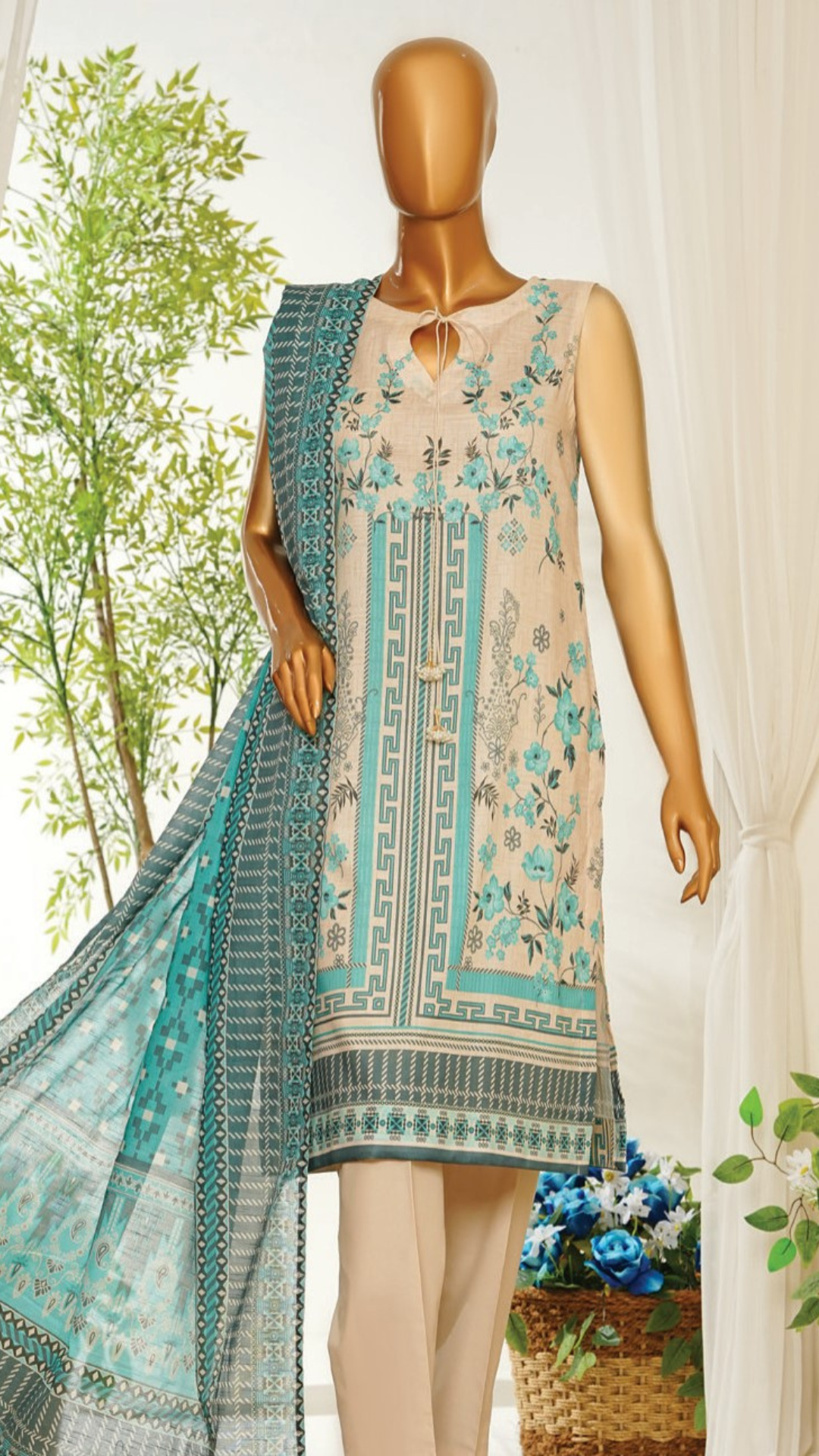 Mannequin wearing MTJ  a floral dress with a matching dupatta in an outdoor setting