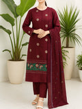Maroon traditional outfit with floral patterns in a minimal indoor setting