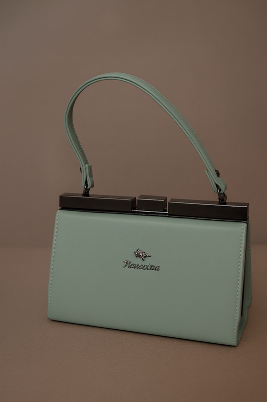 Mint green handbag with a handle on a brown background