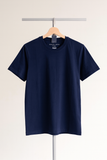 Navy blue t-shirt on a hanger against a plain background