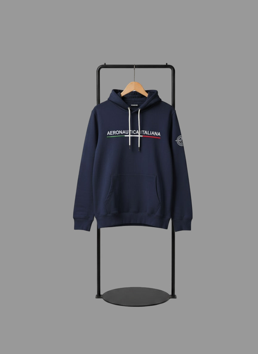Navy hoodie with brand logo on a black stand against a gray background