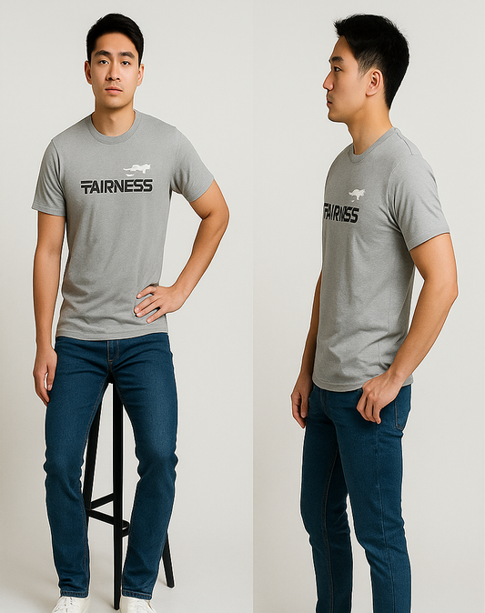 Person wearing a gray t-shirt with 'FAIRNESS' text and logo, standing against a plain background.