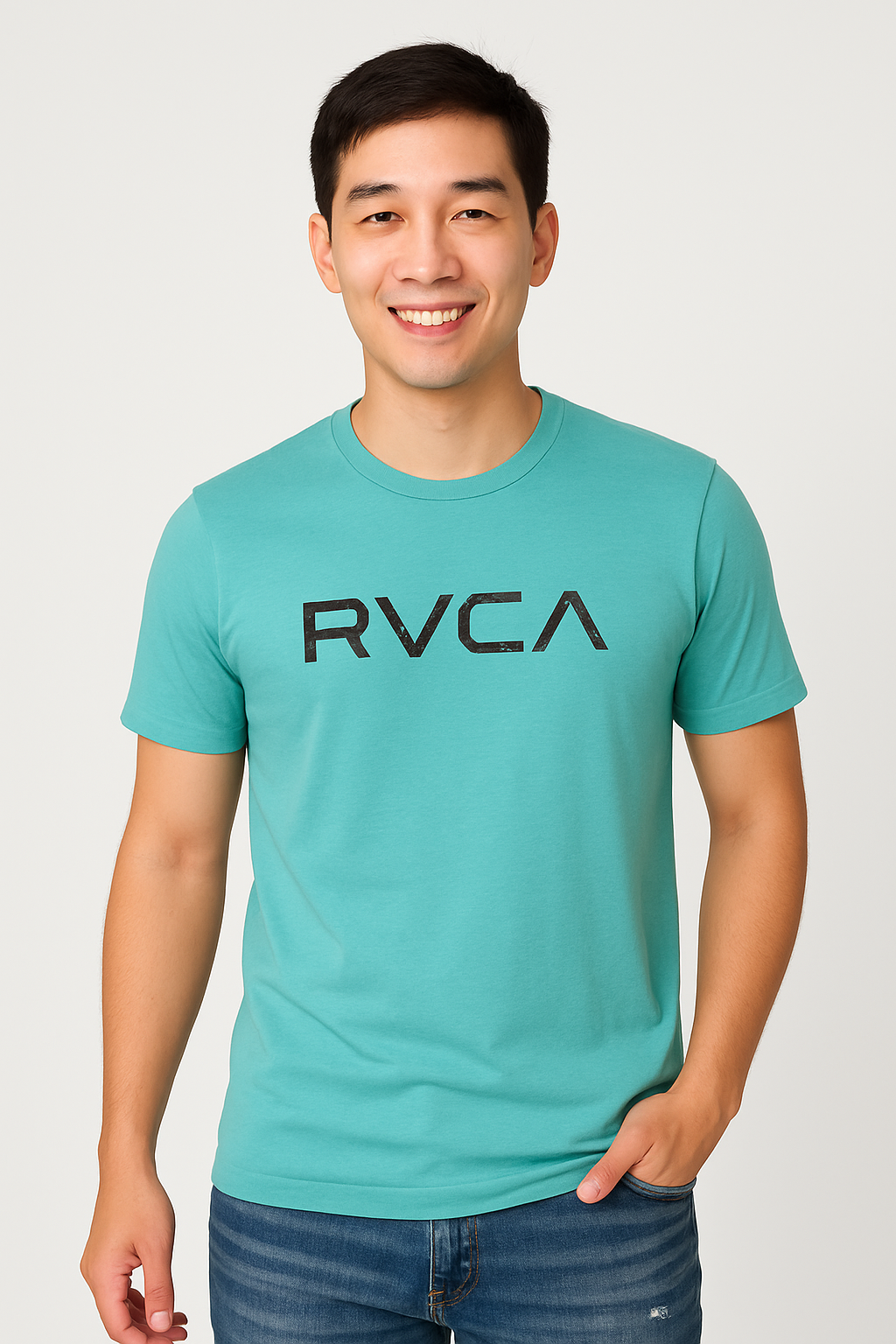 Person wearing a teal t-shirt with 'RVCA' text on a white background.