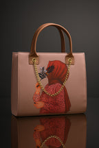 Pink handbag with a decorative chain and design on a reflective surface.
