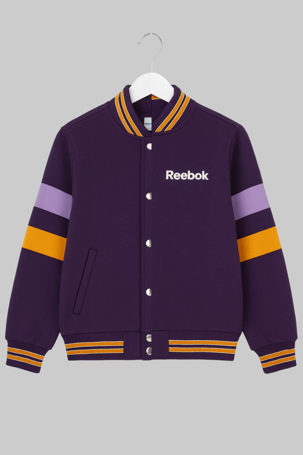 Purple Reebok jacket with colorful stripes on a gray background