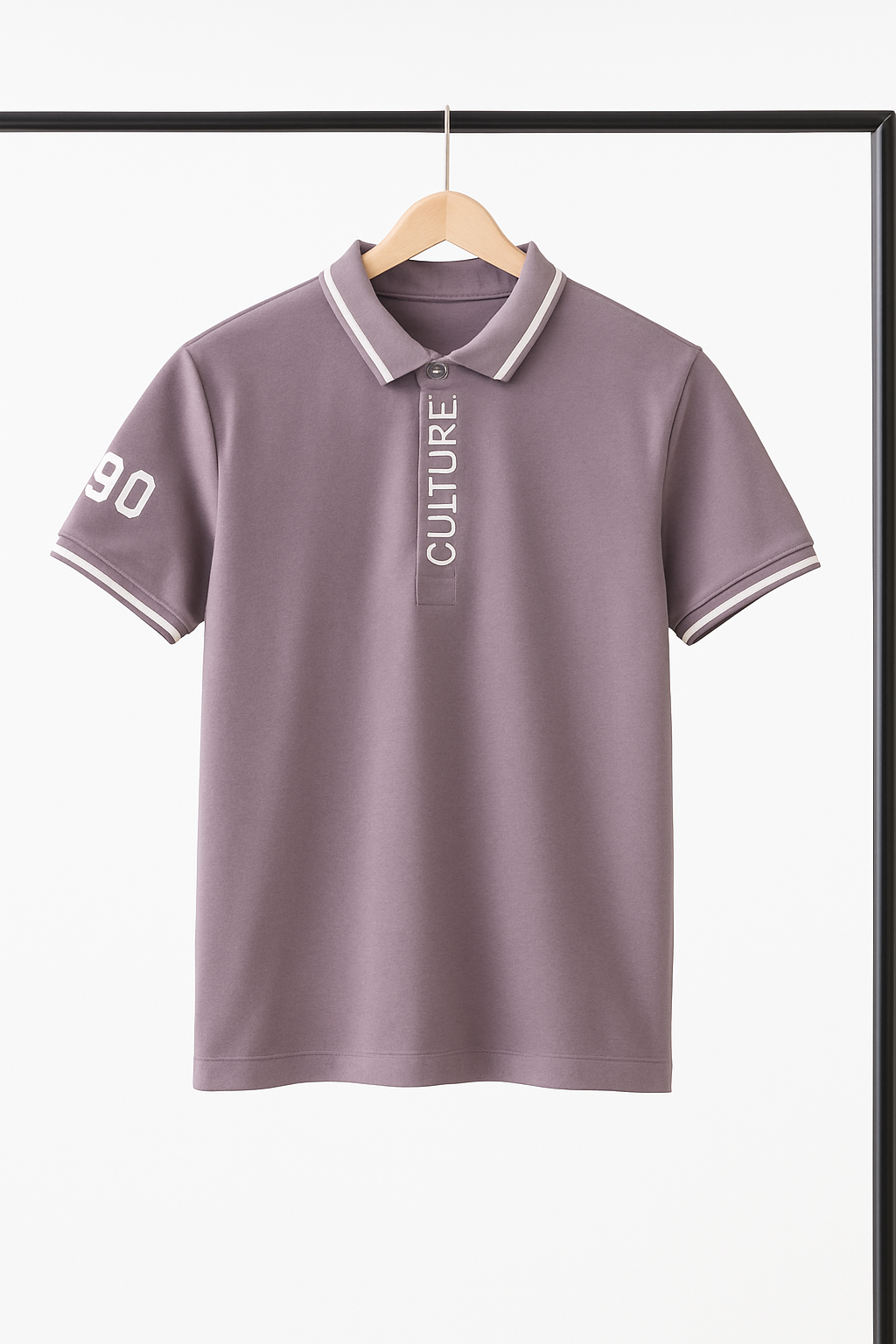Purple polo shirt with text on a hanger against a white background