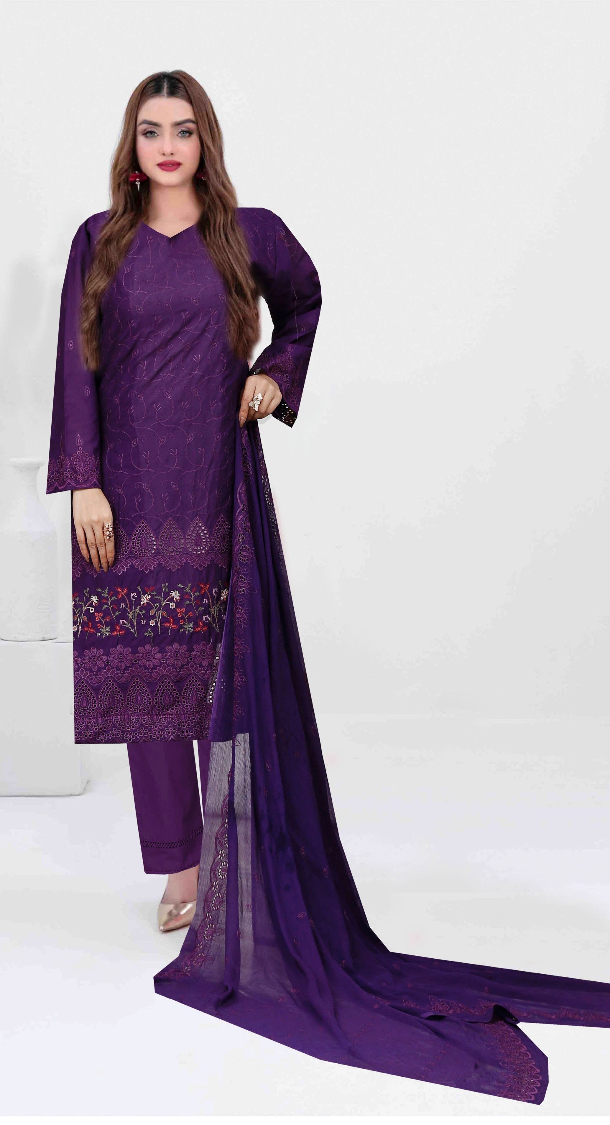 Purple traditional outfit with a sheer dupatta on a white background