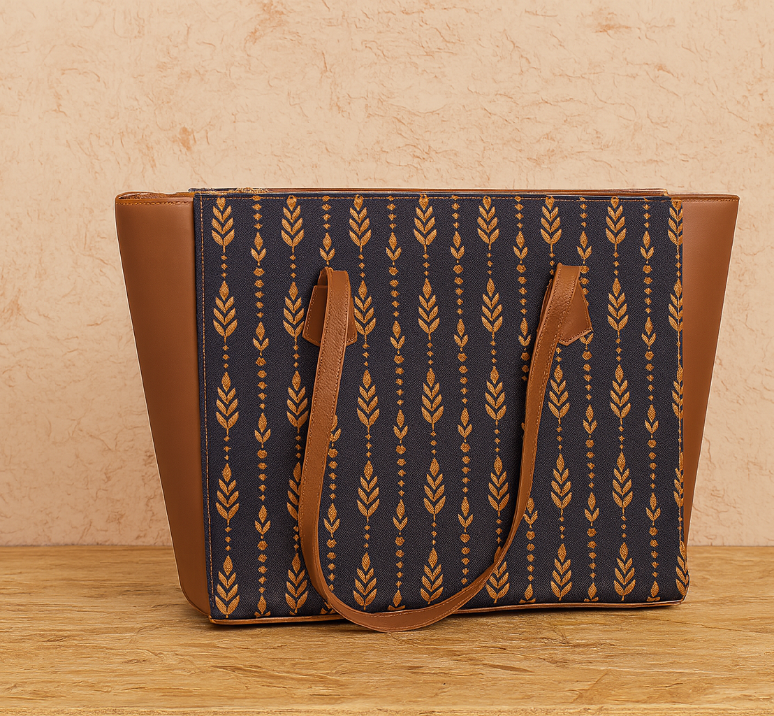 Tote bag with brown and navy pattern on a wooden surface