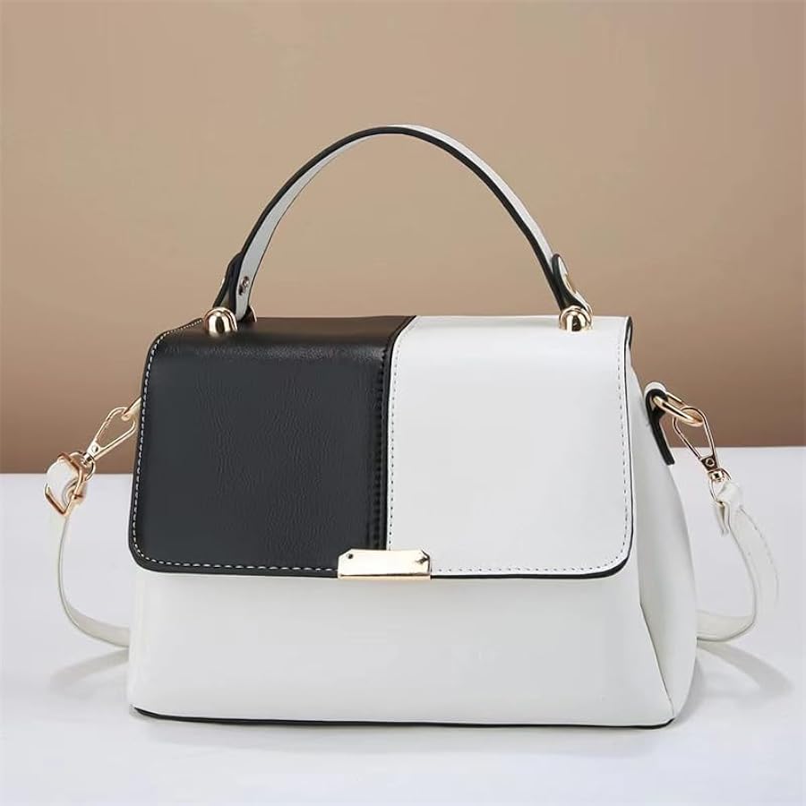 Two-tone black and white handbag on a beige background