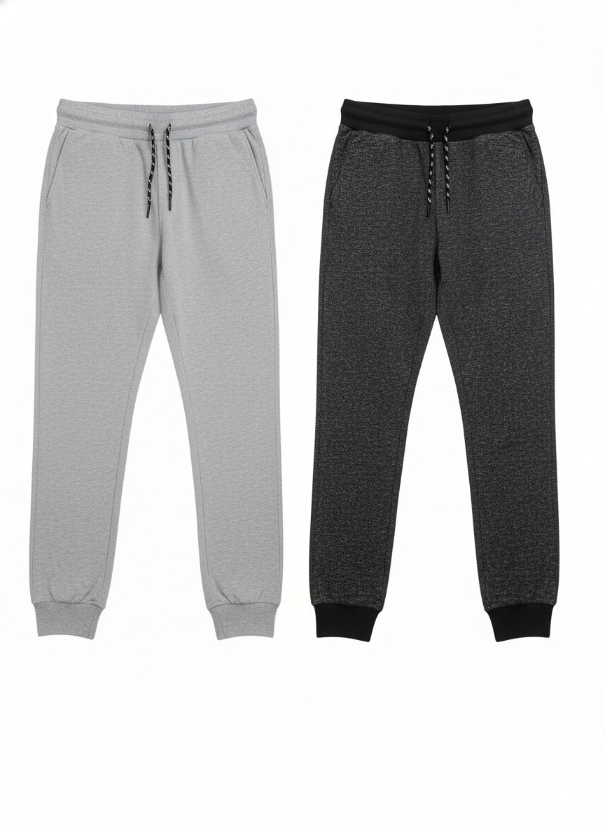 Two pairs of jogger pants, one gray and one black, on a white background.