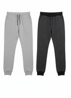 Two pairs of jogger pants, one gray and one black, on a white background.