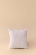 White pillow on a beige background