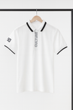 White polo shirt with black accents and 'CULTURE' text on a hanger against a white background