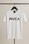White t-shirt with 'RVCA' logo on a hanger against a neutral background