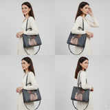 Woman holding a blue handbag with a cat design on a white background