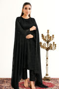 Woman wearing a black traditional outfit with a candelabra in the background