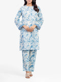 Woman wearing a blue and white floral outfit on a white background