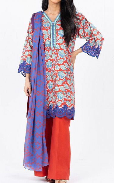 Woman wearing a colorful traditional outfit with a red and blue pattern on a white background