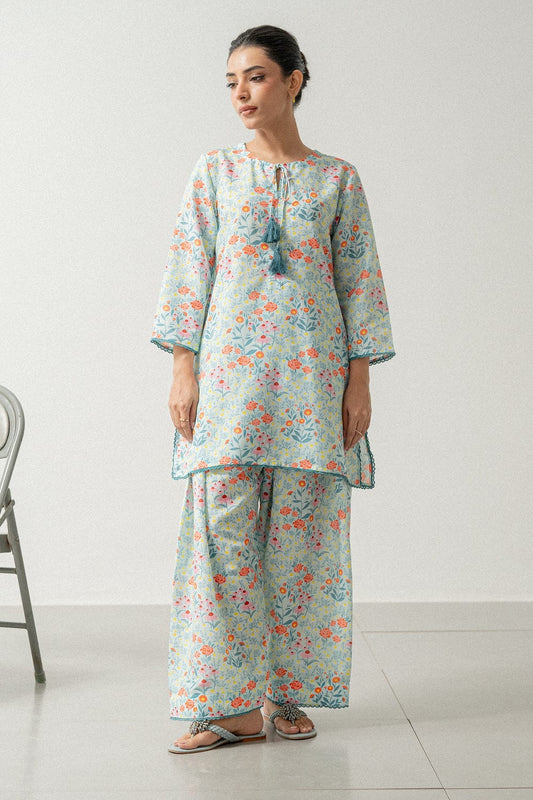 Woman wearing a floral outfit on a white background