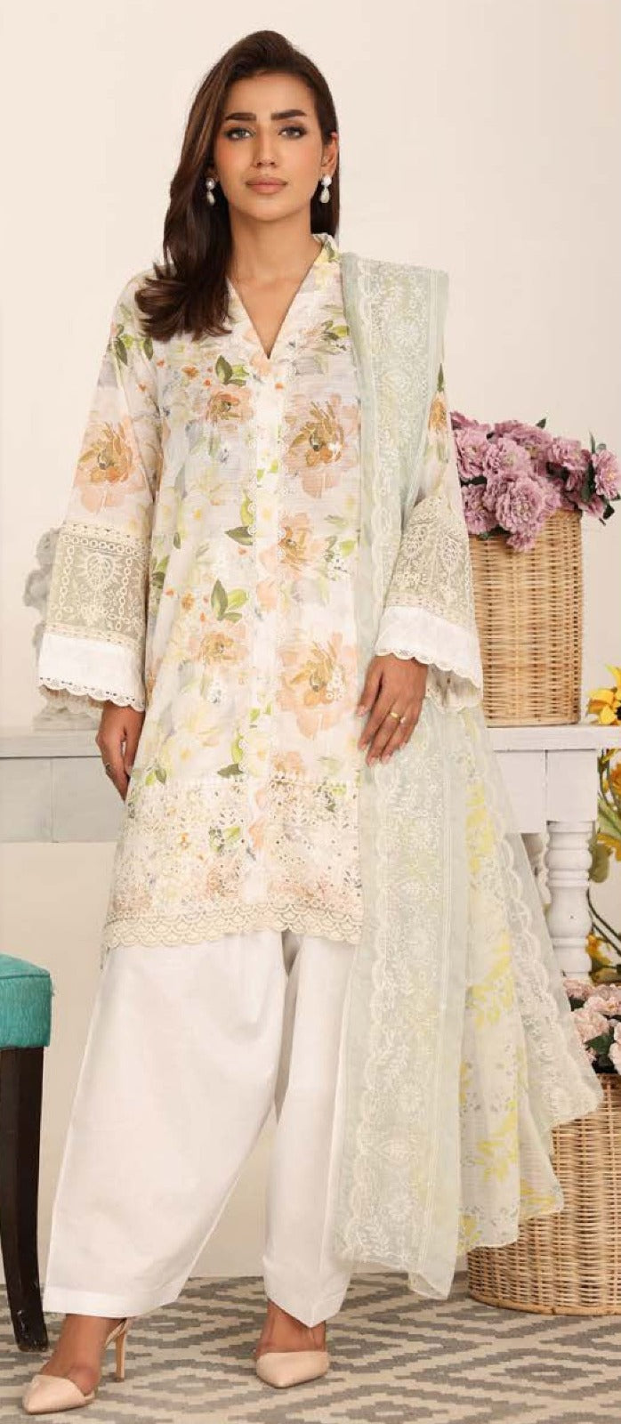 Woman wearing a floral dress with a light background