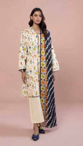 Woman wearing a floral kimono-style outfit on a pink background