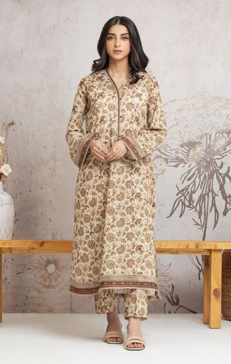 Woman wearing a floral kurta set against a neutral background