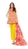 Woman wearing a floral top and yellow trouser with a matching scarf on a white background