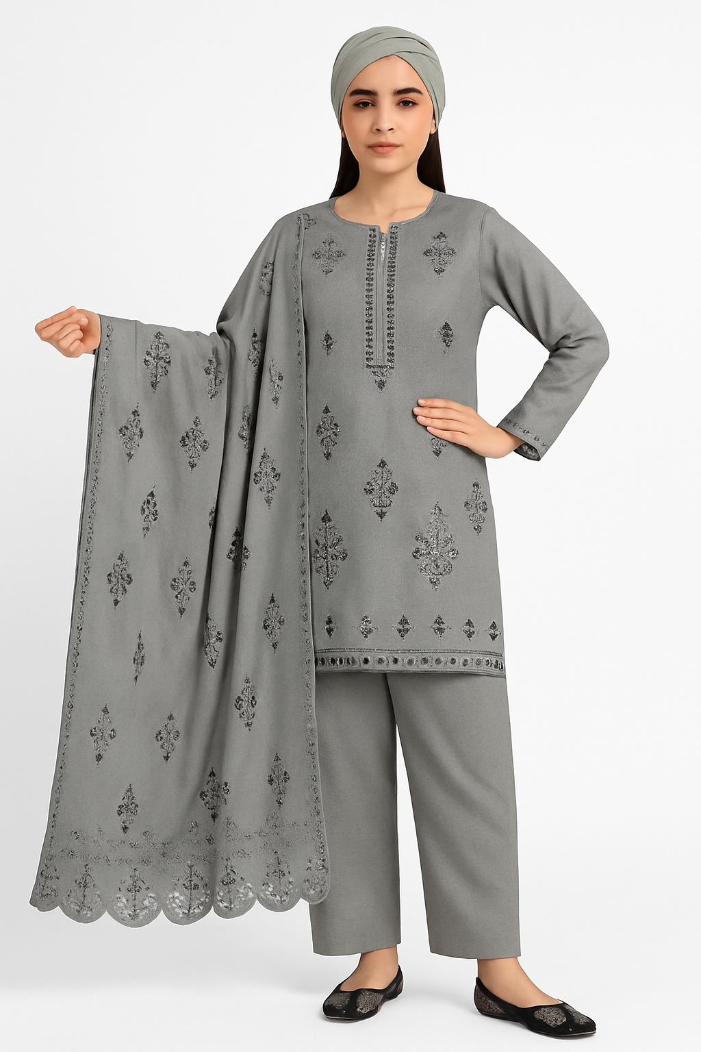 Woman wearing a gray traditional outfit with an embroidered dupatta on a white background