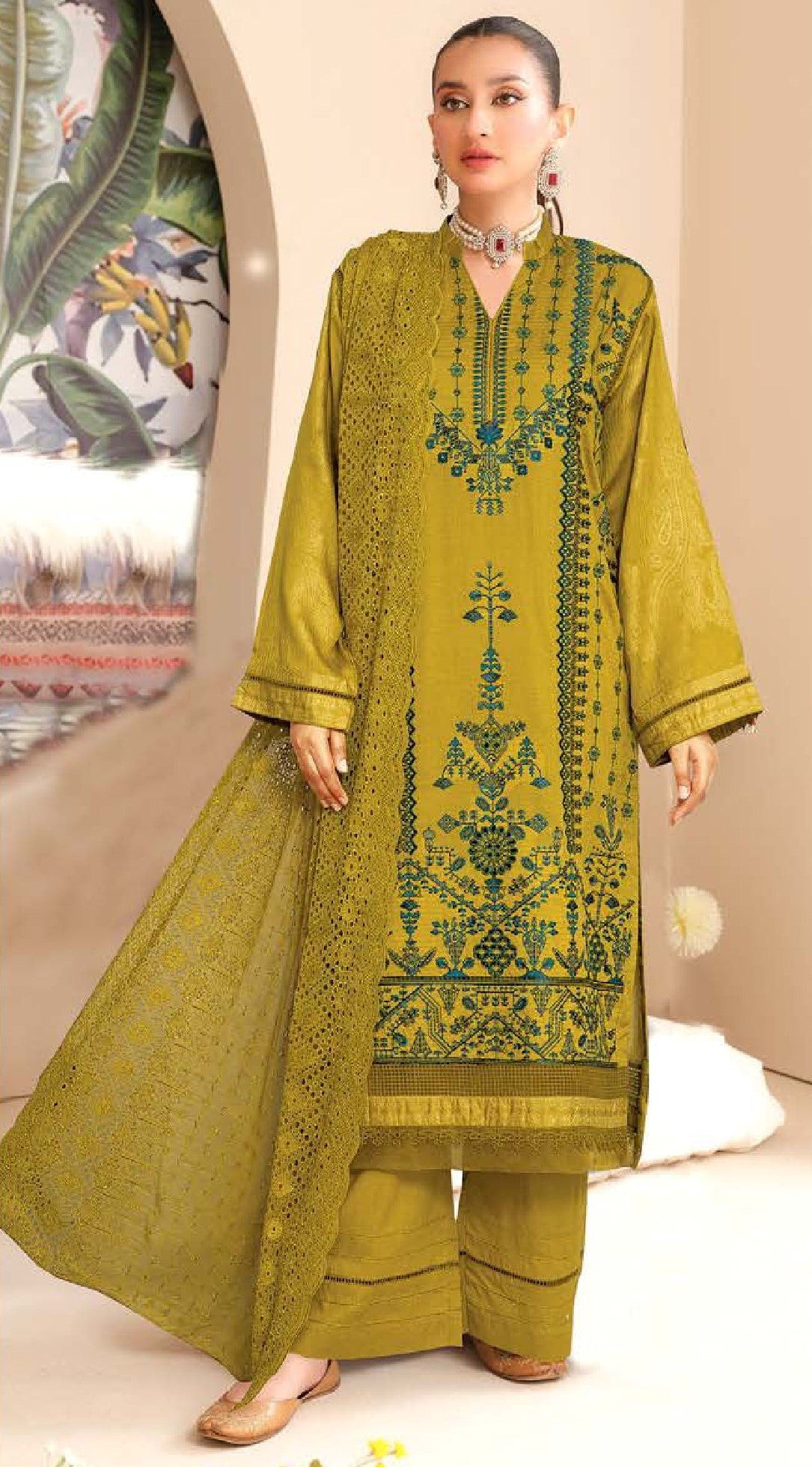 Woman wearing a green embroidered traditional outfit with a beige background