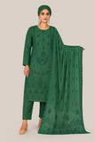 Woman wearing a green traditional outfit with a matching dupatta on a beige background