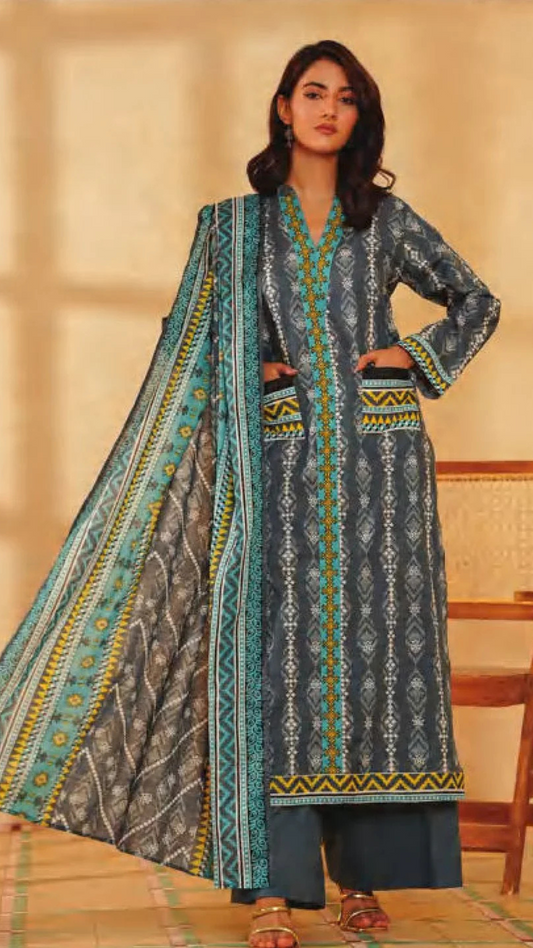 Woman wearing a patterned shirt with a dupatta trouser against a neutral background