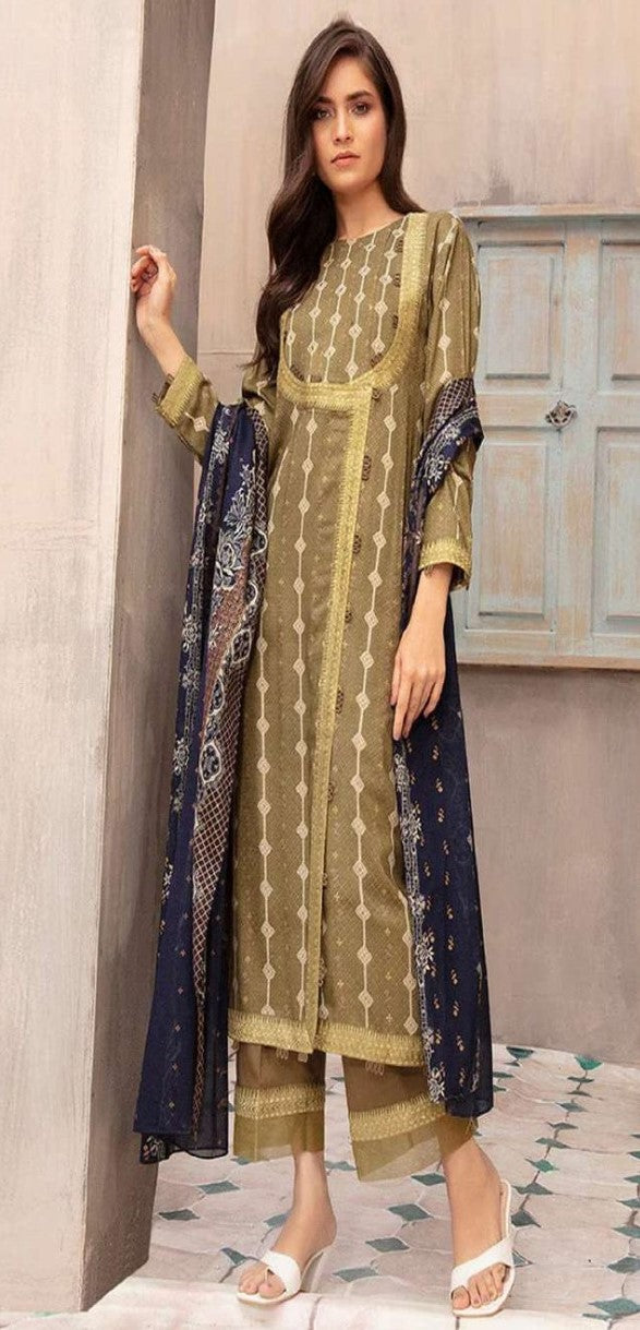 Woman wearing a traditional outfit with a green and blue patterned dress against a neutral background