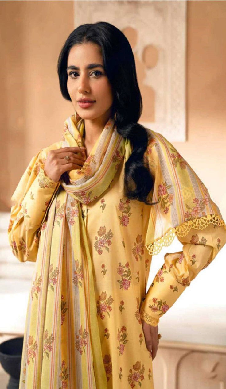Woman wearing a yellow floral traditional outfit indoors