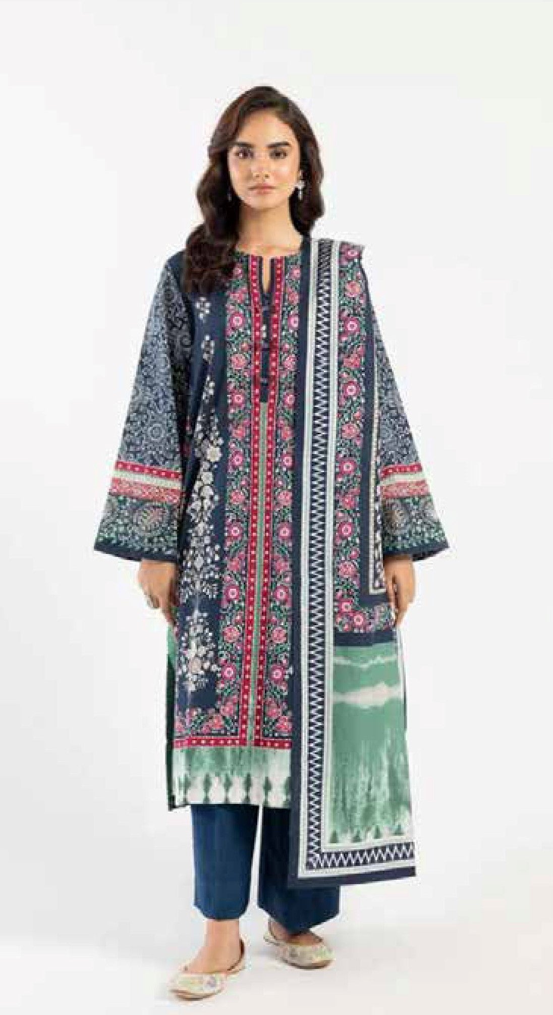 Woman wearing a patterned dress with a white background