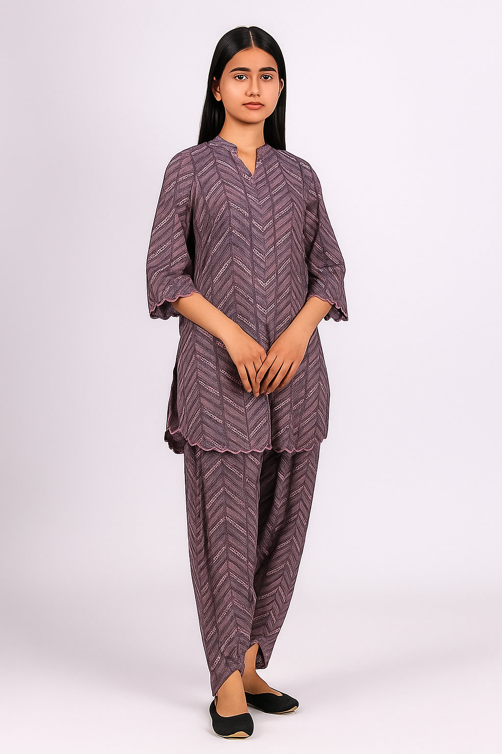 Woman wearing a patterned outfit on a white background