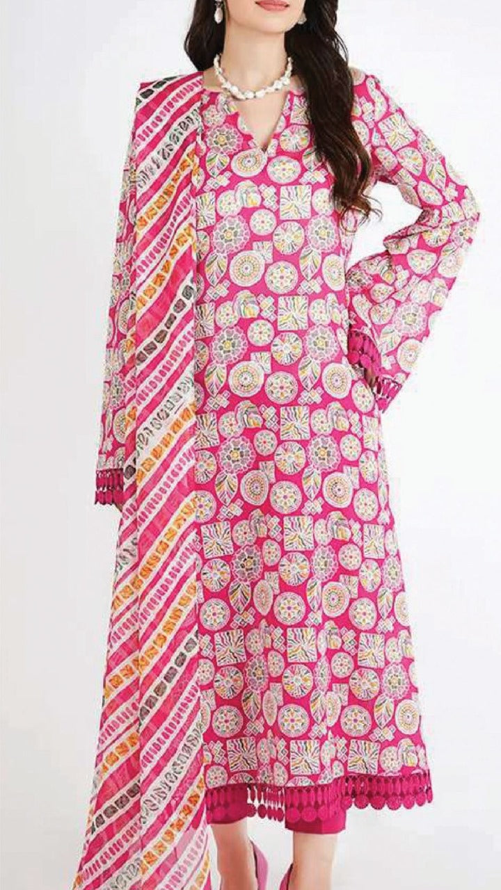 Woman wearing a pink and multicolor patterned dress on a white background