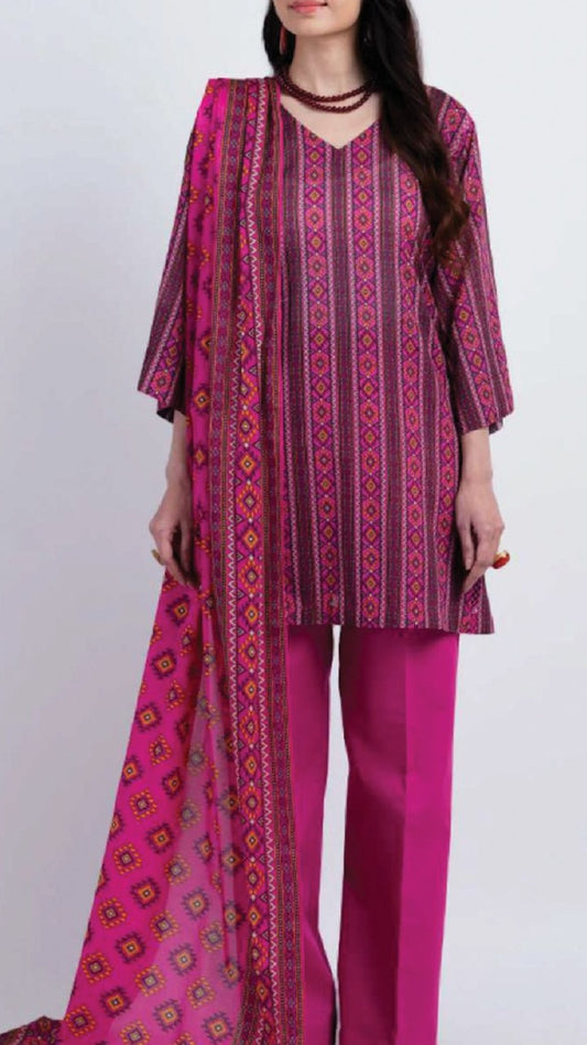 Woman wearing a pink and purple patterned outfit with a scarf on a white background