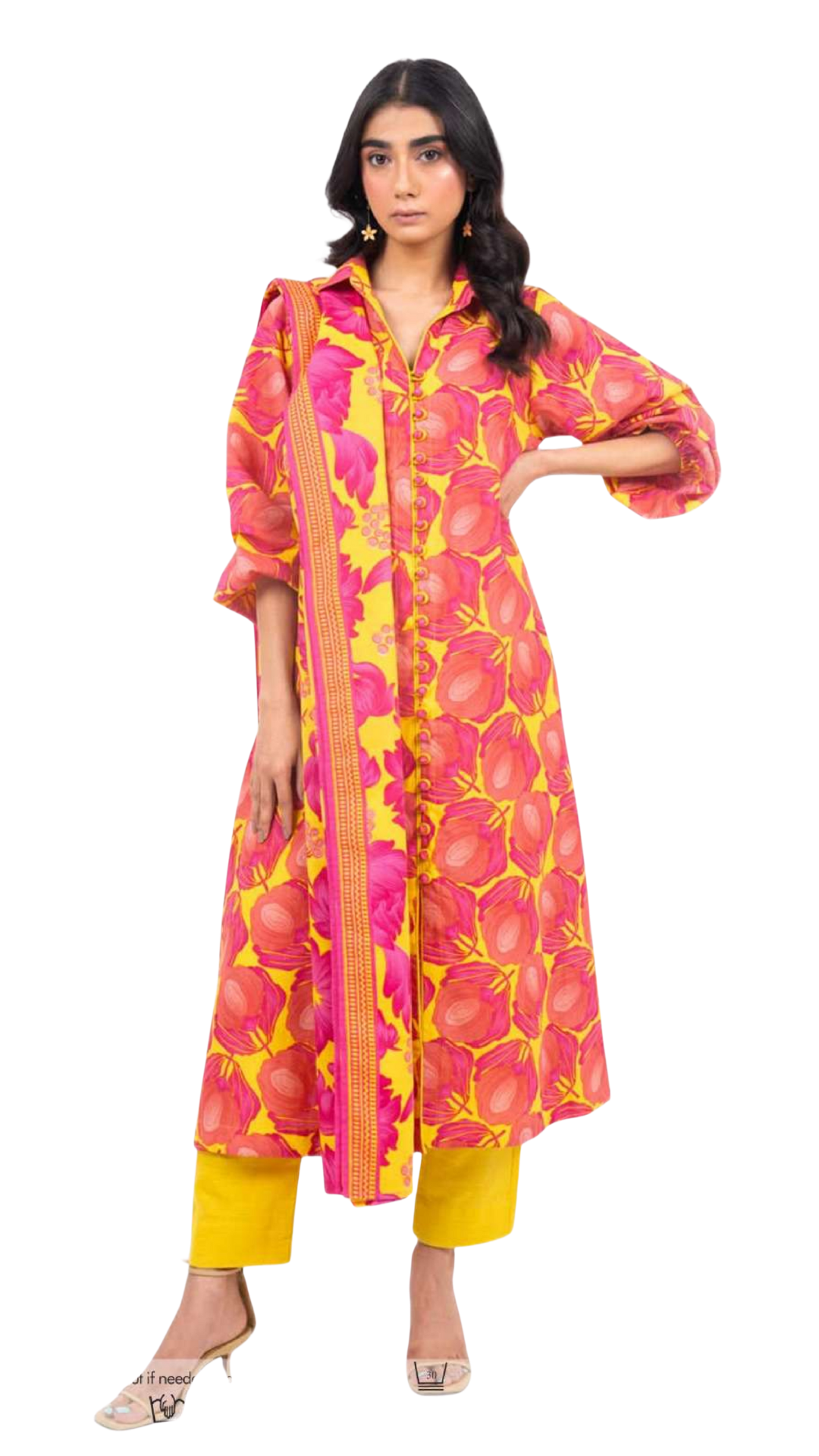 Woman wearing a pink and yellow patterned kurta with yellow pants on a white background