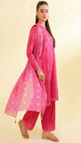 Woman wearing a pink traditional outfit with a sheer dupatta on a beige background
