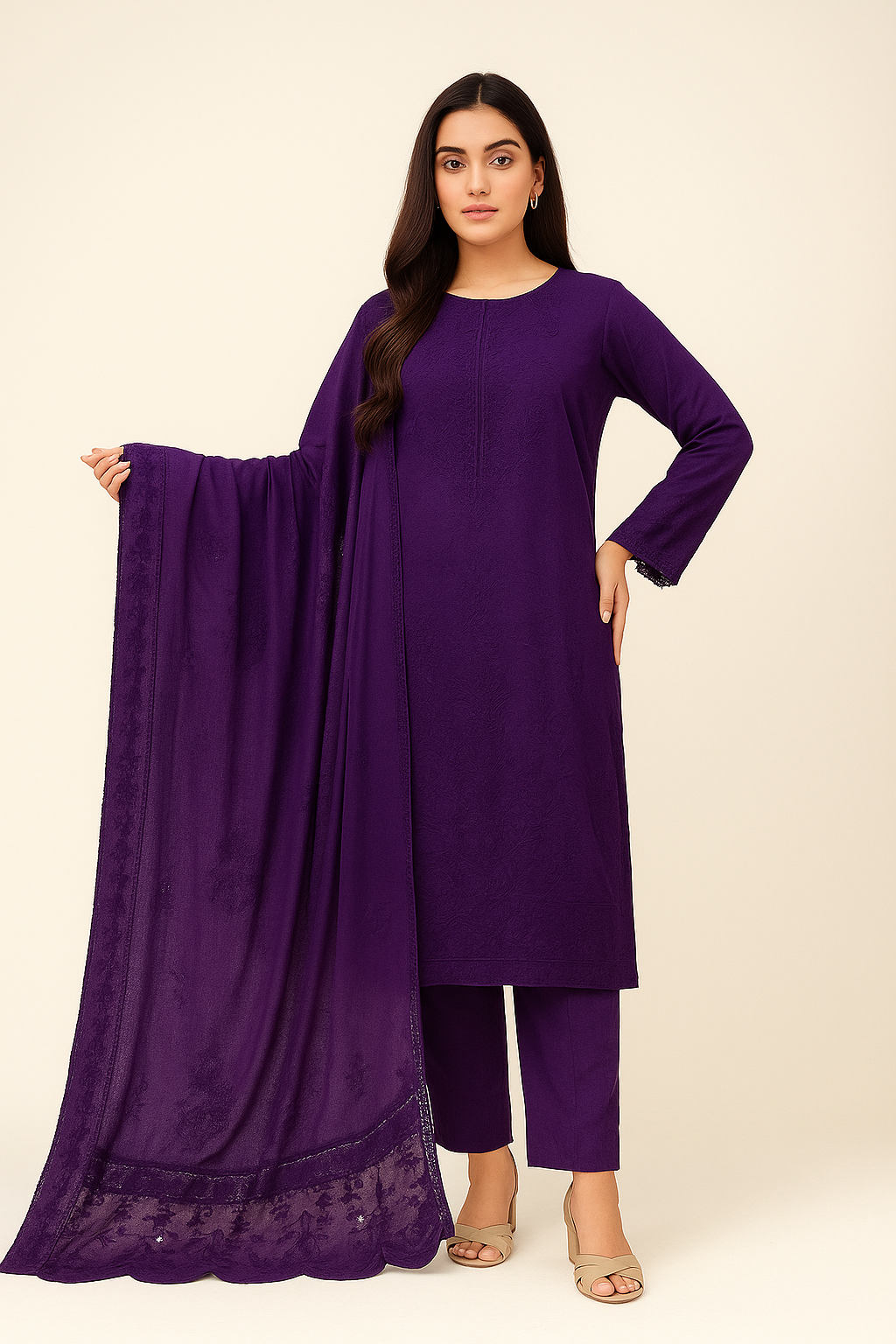 Woman wearing a purple outfit with a matching dupatta on a beige background