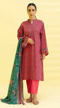 Woman wearing a red and pink traditional outfit with a green dupatta on a beige background
