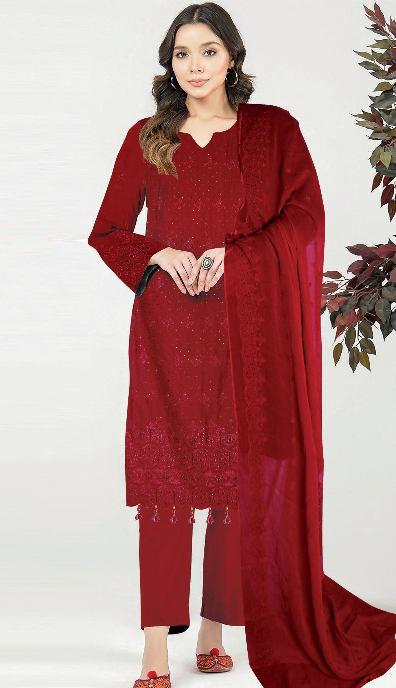 Woman wearing a red traditional outfit with a white background