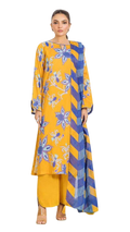 Woman wearing a yellow and blue patterned outfit on a white background