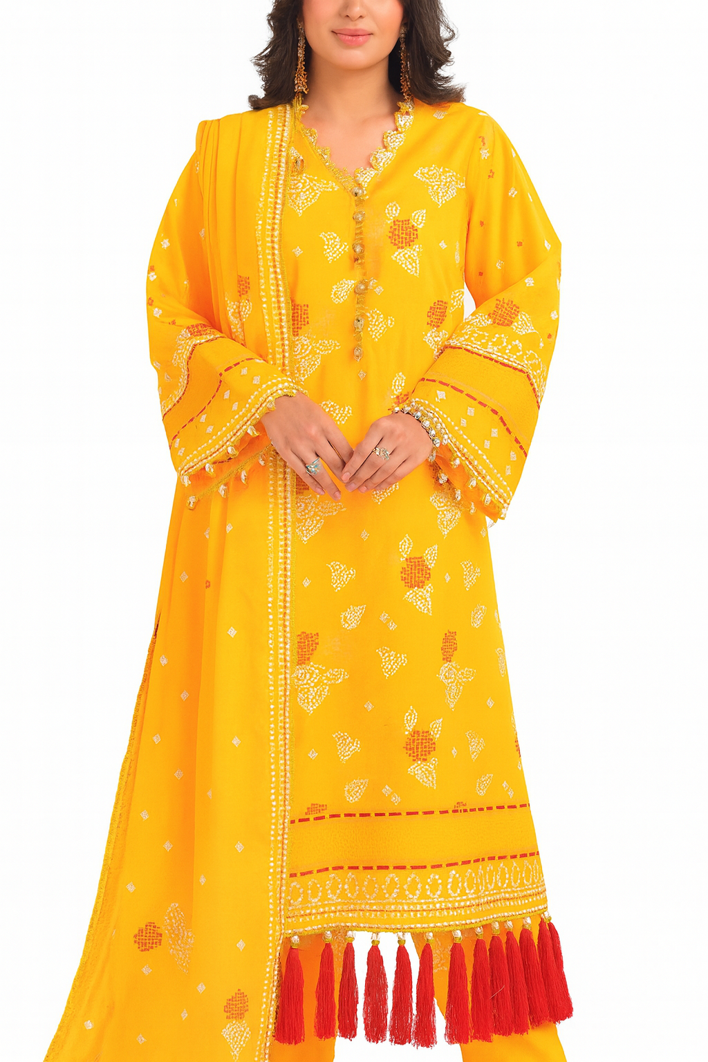 Woman wearing a yellow traditional outfit with red tassels on a white background