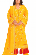 Woman wearing a yellow traditional outfit with red tassels on a white background