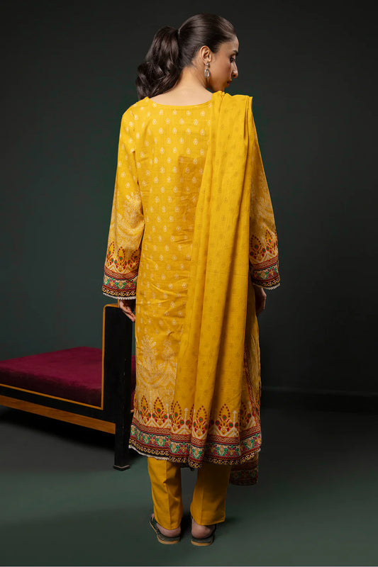 Woman wearing a yellow traditional outfit with a dark background
