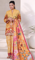 Woman wearing a yellow traditional outfit with floral patterns, holding a matching dupatta.