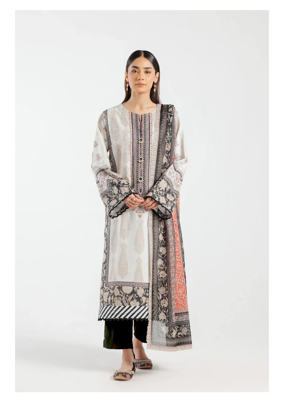 A woman wearing a traditional ethnic 3-piece lawn suit which includes a printed lawn shirt, a dupatta, and a dyed cambric trouser.