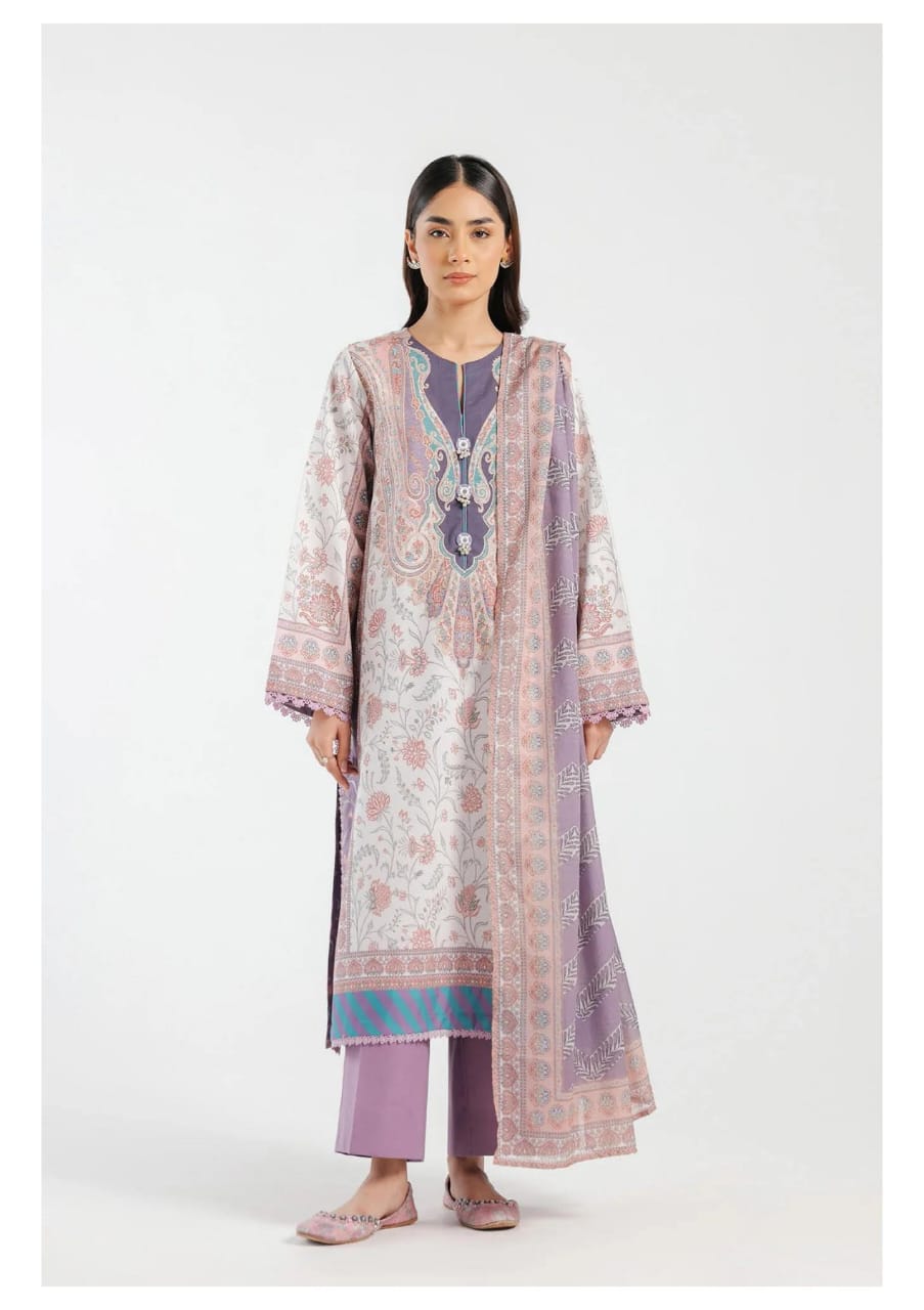 Woman wearing a traditional outfit with intricate patterns on a white background