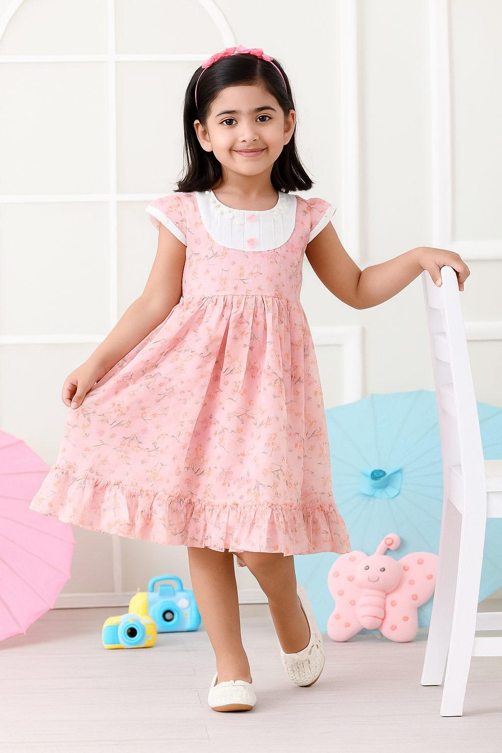 Young girl wearing a light pink dress